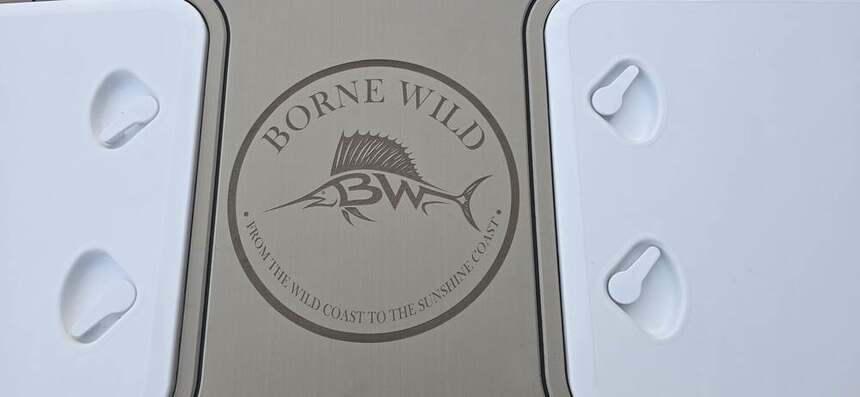 Borne Wild — marlin badge inlaid at the transom